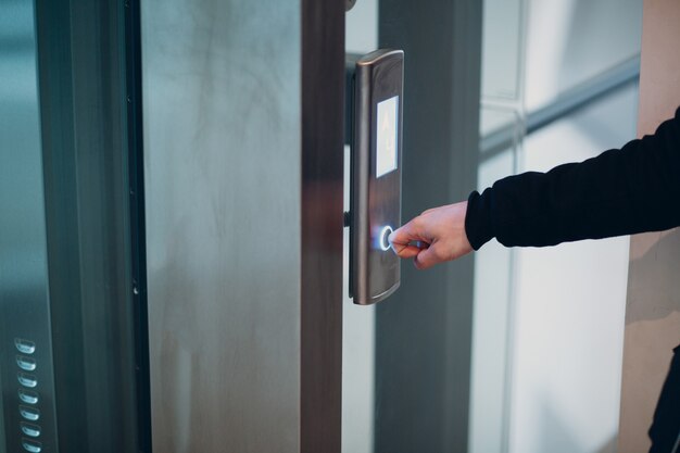 close-up-forefinger-pressing-button-elevator-coronavirus-pandemic-covid-19-quarantine-concept_183314-6062